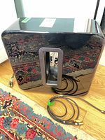 Front view of gloss black Sonos Sub Gen 3 with cables