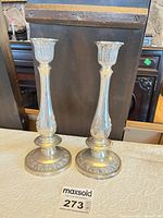 Front view of both sterling candlesticks