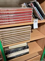 Stack of Time-Life slipcased volumes and additional art books on shelf