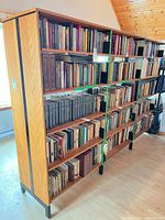 Full view of double-sided shelving loaded with books