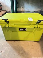 Front view of lime YETI hard cooler closed