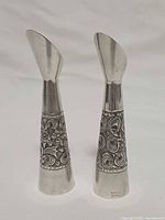 Front view of both sterling silver bud vases showing decorative bands and shape