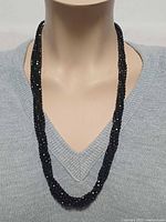 Necklace on mannequin front view showing drape and bead sparkle