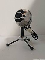 Front view of Blue Snowball microphone on tripod stand