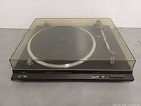 Overall view of Technics SL-DD22 turntable with dust cover closed