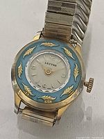 Front view of Lectro watch showing dial, bezel and case