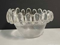 Front view showing textured body and droplet rim