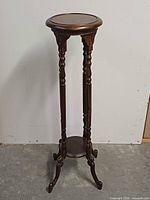 Full view of mahogany pedestal stand front angle