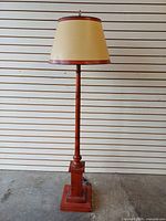 Full view of wooden floor lamp with shade