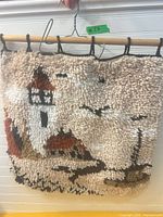 Front view of shag latch hook lighthouse wall hanging