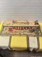 Front view of rectangular billiards themed light with graphics visible