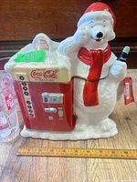 Front view of ceramic polar bear cookie jar with tag attached