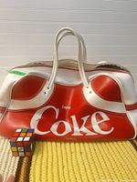Front view showing Coke graphic and handles