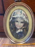 Front view of oval framed portrait