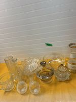 Group shot of all clear glass items on table