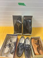 Overall view of all five shoe pairs in boxes