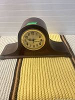 Front view showing full clock, shape and dial