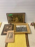 Overview of all four framed pieces on rug