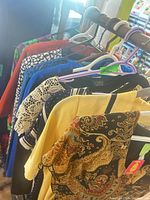 Rack showing multiple dresses on hangers