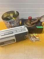 Overall lot showing Sony cassette player, RCA Victor record player, tin and small packet