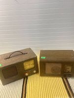 Both Viking and Marconi radios side by side on mat