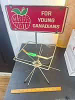 Full view of rack with sign and ruler for scale