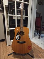 Full view of guitar front, showing body and headstock