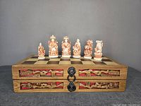 Closed chess box showing board surface and some pieces set up