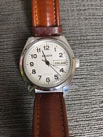 Front view of Raketa wristwatch showing dial, case, strap