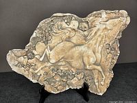 Front view of plaster relief showing full horse depiction