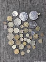 All coins spread out on fabric showing variety and condition