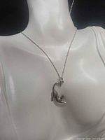 Necklace displayed on bust showing overall length and pendant placement
