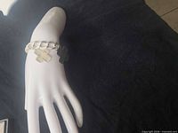 Bracelet on display hand showing overall appearance and fit
