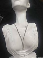Necklace draped on mannequin showing overall Y-shape