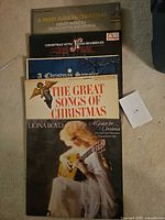 Stack of five Christmas vinyl records