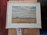 Front view of framed landscape print with frame and mat visible