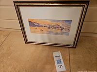 Front view of framed watercolor with mat and gold-finish wood frame, lot tag visible