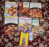 All seven cookbooks fanned out on carpet for overview