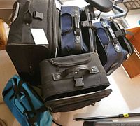 Group of stacked suitcases showing quantity and colors