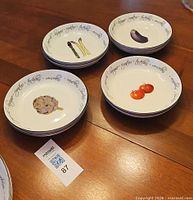Stacked porcelain bowls with vegetable motifs