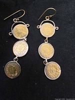 Front view of both earrings showing design and materials