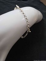 Bracelet draped to show link style and clasp