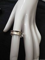 Ring on display finger showing exterior engraving "T & Co. 1837"