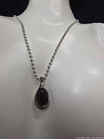 Necklace on display bust showing pendant and chain style