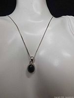Necklace on display bust showing full length and pendant detail