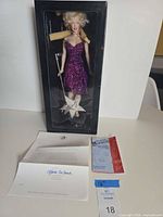 Boxed Franklin Mint Marilyn Monroe doll with paperwork displayed