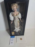 Doll in original Franklin Mint window box with certificate visible