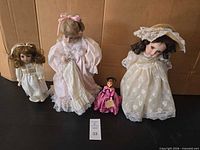 Group shot of all four dolls and stands