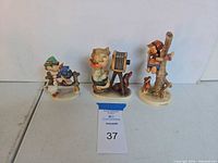 All three figurines front view