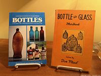 Front covers of both bottle reference books